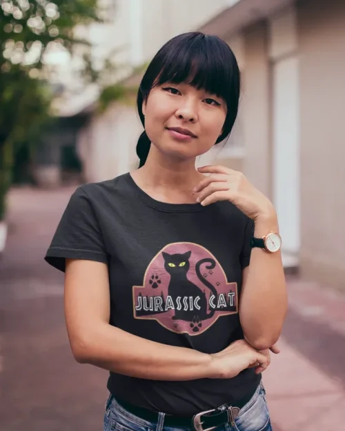 model wearing white t-shirt with black cat fun design jurassic kitten