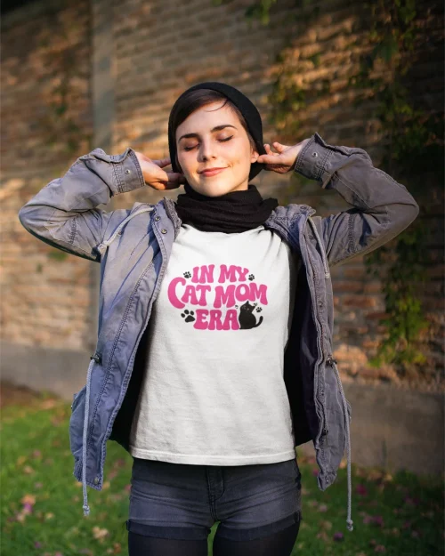 model wearing white t-shirt with in my cat mom era design