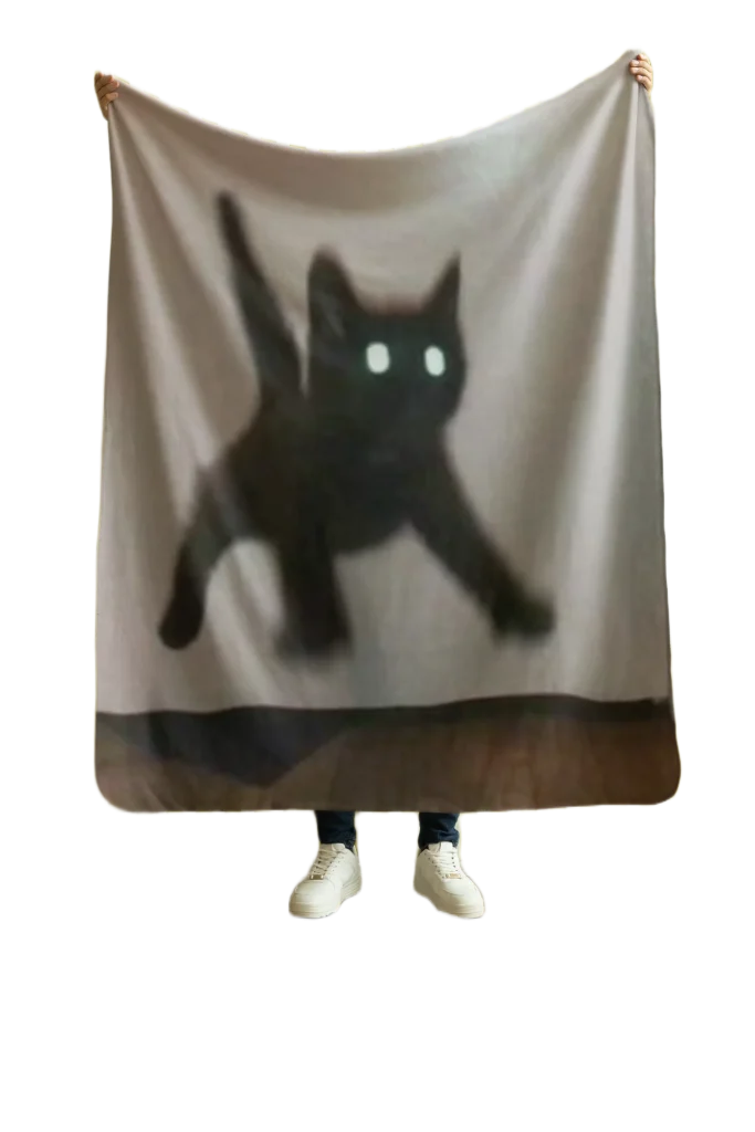 man holding grey blanket with void cat design