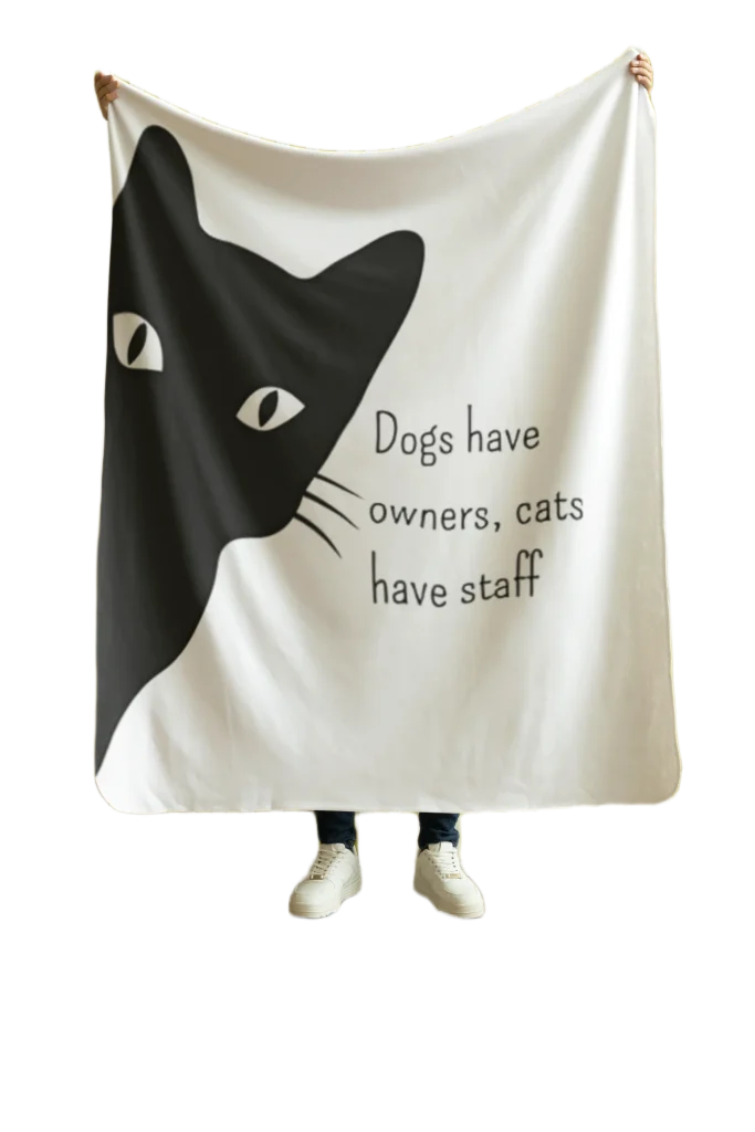 man holding white blanket with void cat design